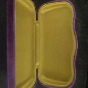 One snazy purple Gucci sunglass case.  c